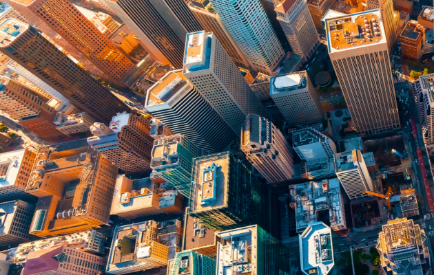 Bird's eye view of a city with sky scrapers at dusk Bird's eye view of a city with sky scrapers at dusk
